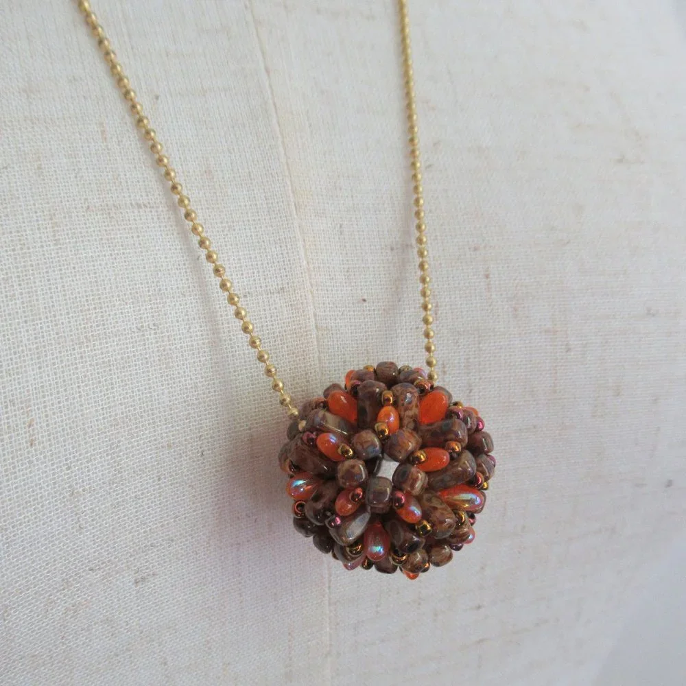 Handwoven Fall color beaded bead pendant